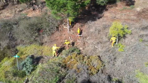 This is an aerial view of several crew members working on an emergency project. 
