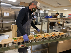 Governor Newsom prepares food at St. Anthony's on Martin Luther King Jr. Day. 