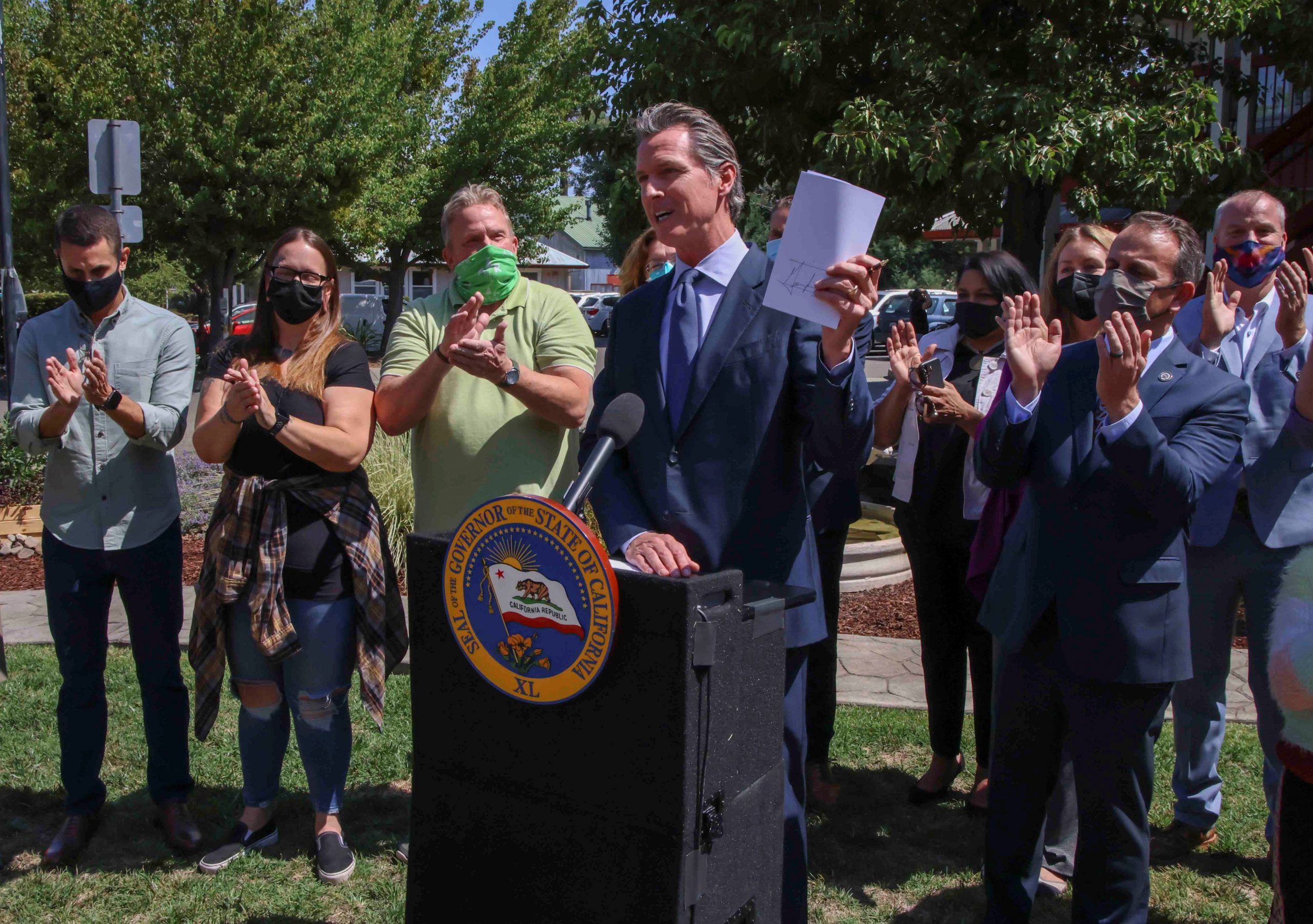 Gov Newsom signs bill outdoors