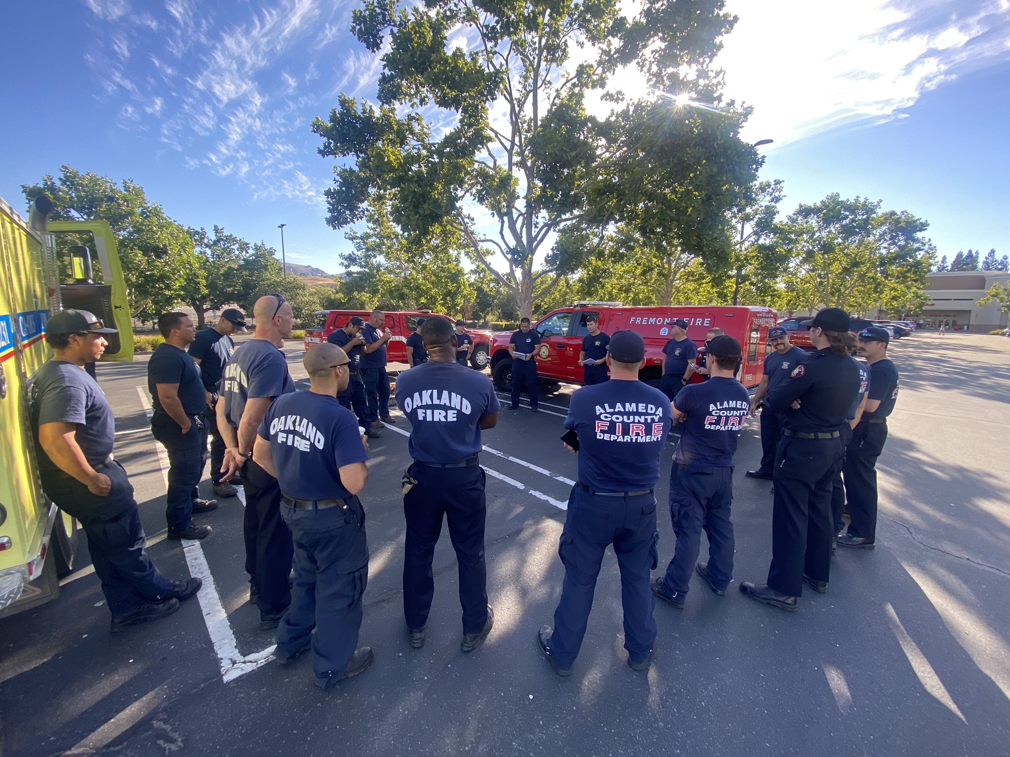 Fire personnel from Fremont, Hayward, Alameda and Oakland in a circle
