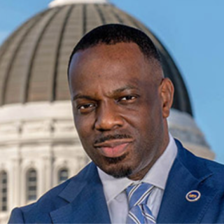 Headshot of Secretary Toks Omishakin