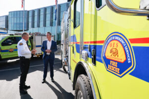A photo of Governor Newsom and Cal OES Chief Marshall in front of a fire engine.