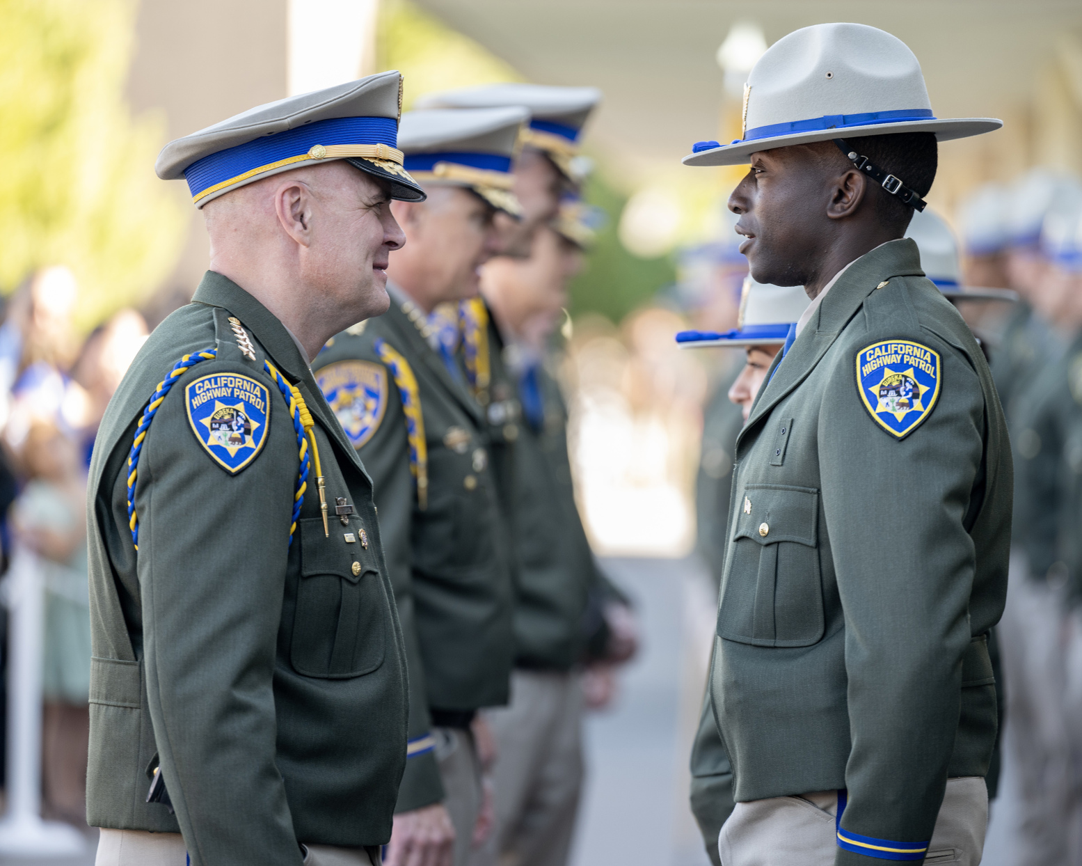 Photo of CHP Commissioner Sean Duryee with newly graduated officer