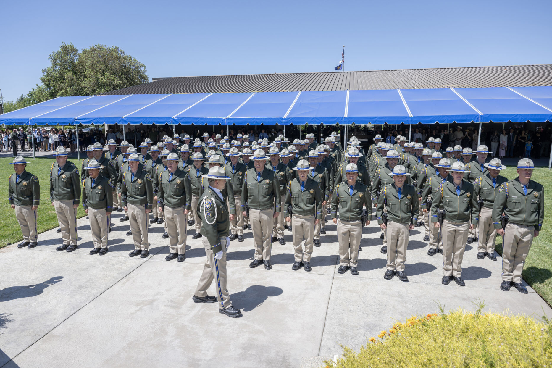 Photo of CHP Commissioner Sean Duryee with entire newly graduated officer class