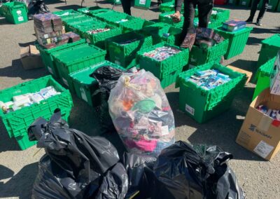 Image of stolen items in green boxes and garbage bags
