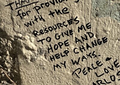 Message from incarcerated persons on a wall to be demolished at San Quentin.