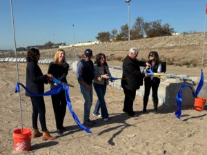 California is launching a pilot project to stop trash from clogging the Tijuana River as part of $35 million in investments to address the ongoing sewage crisis